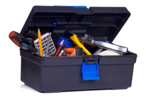 box with tools on white